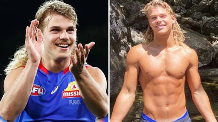 AFL cult hero Bailey Smith was impossible to miss in his sharp grey suit (pictured)
